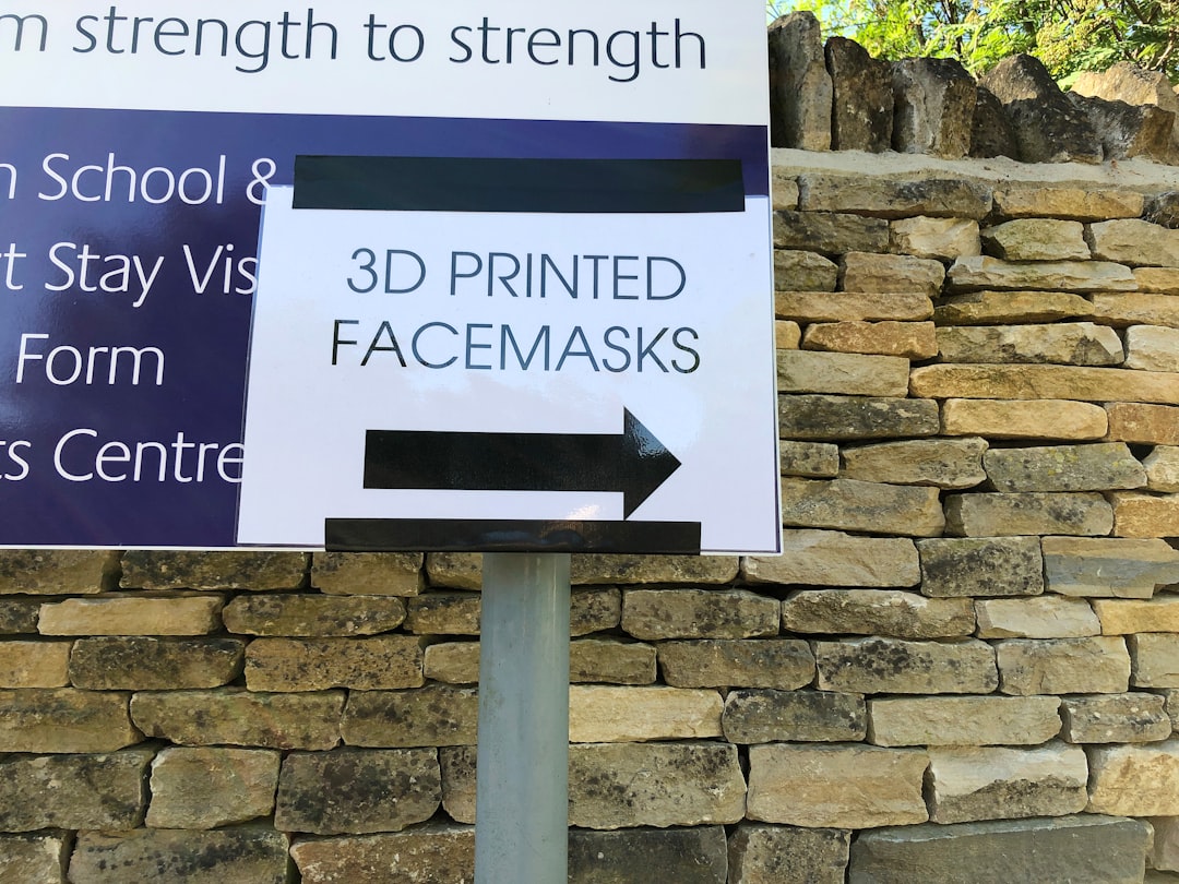 Covid-19 3D printed facemasks sign at a school gate. Local School supporting front line NHS workers.